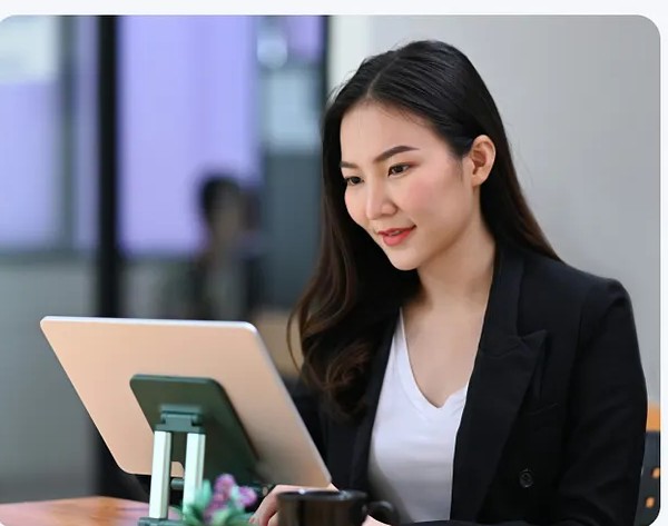 A designer working at a laptop